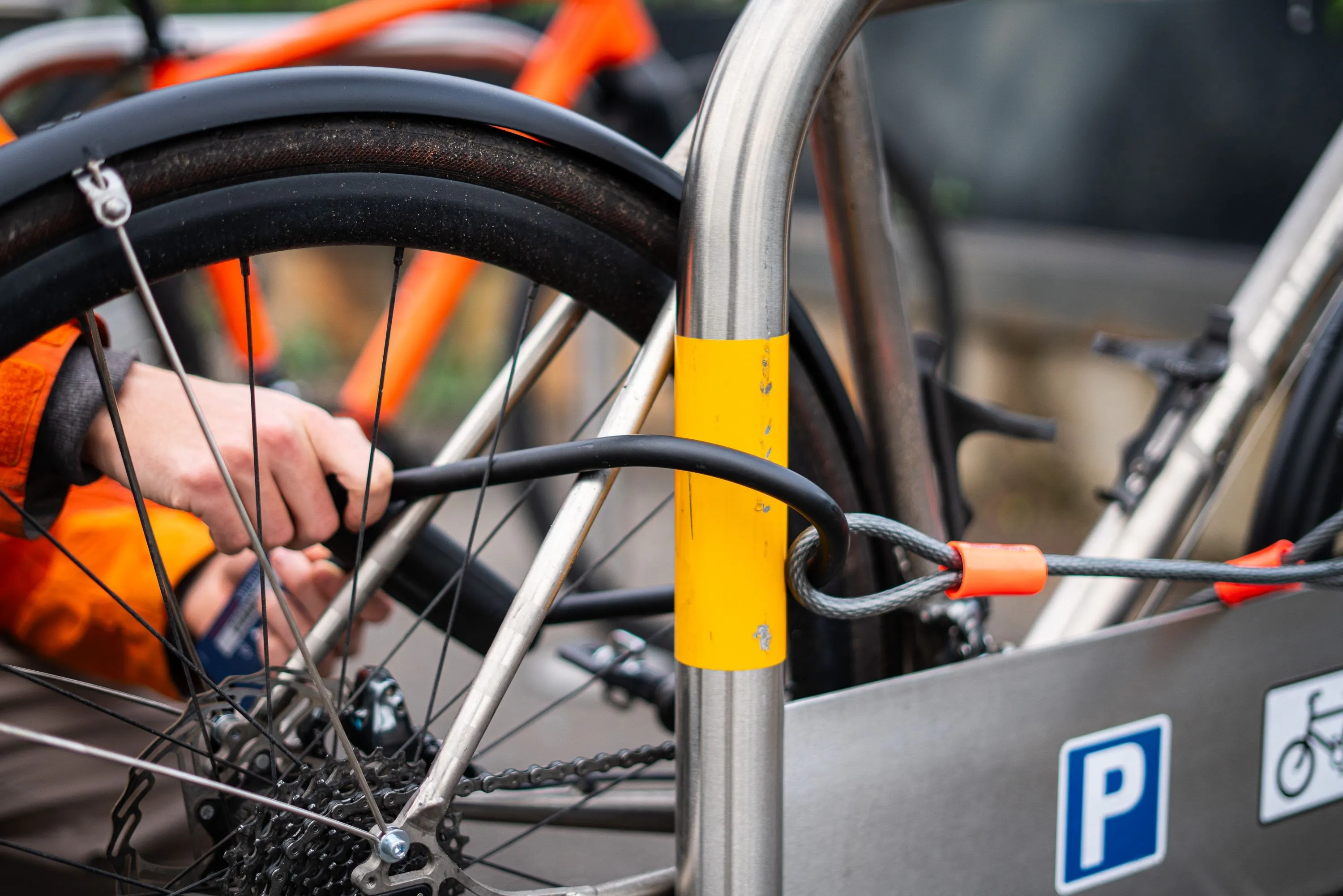 D lock and cable securing bike to Sheffield stand