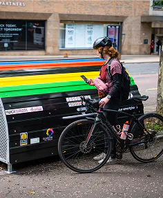 Woman opening hooplr bikehangar