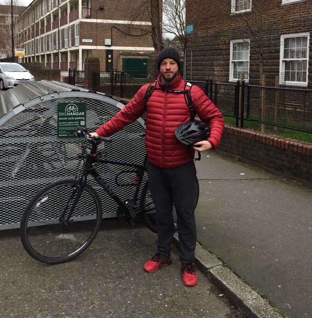 Manuel with bike hangar and bike